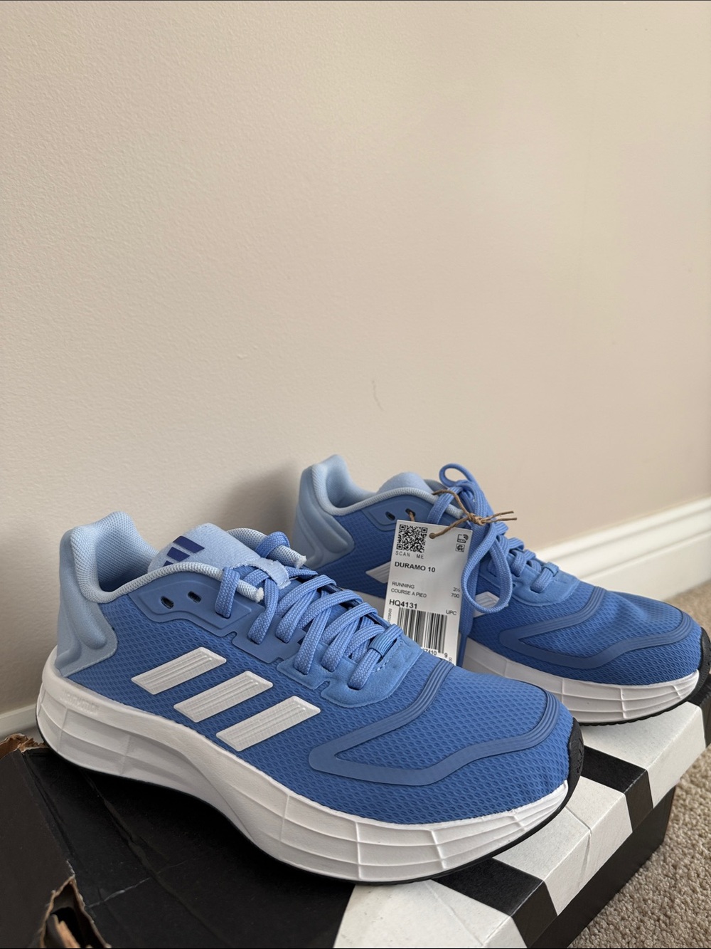 Women’s light blue adidas Duramo 10